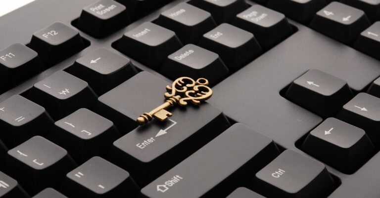 Brass Ornate Vintage Key on Black Computer Keyboard