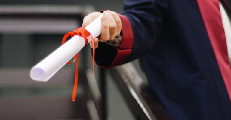 Person Holding White Scroll